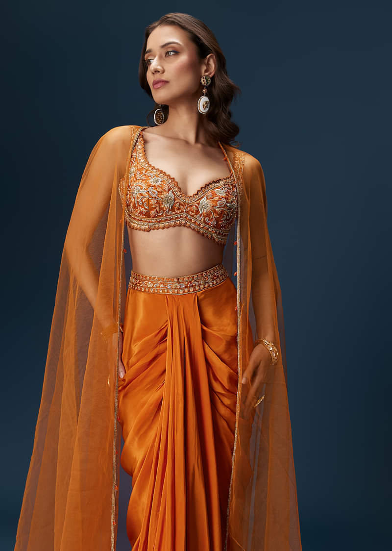 rust-dhoti-skirt-set-with-embellished-blouse-and-tassel-net-dupatta-sg320249-5_dc96c61e-6656-499a-9d3c-80e7d4034216.jpg