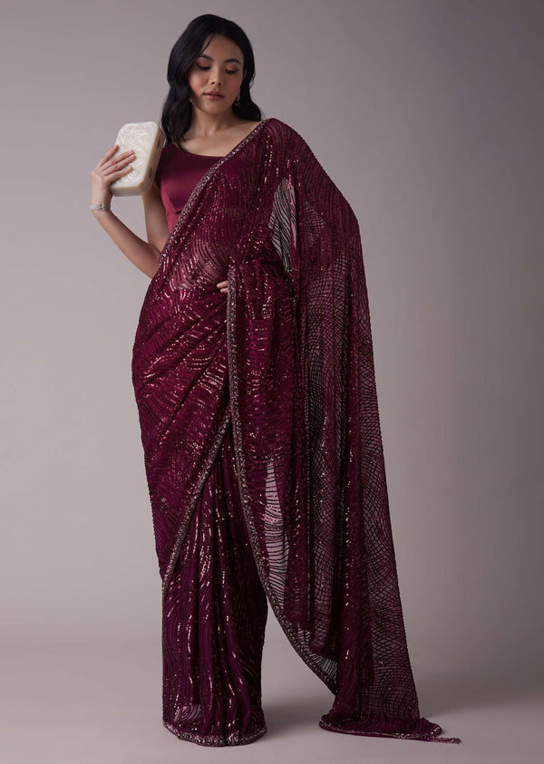 Wine Sequins Saree With An Embellished Border