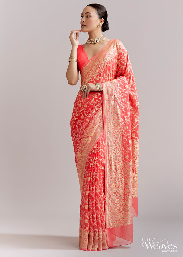 Peach Georgette Woven Saree With Floral Jaal And Heavy Border