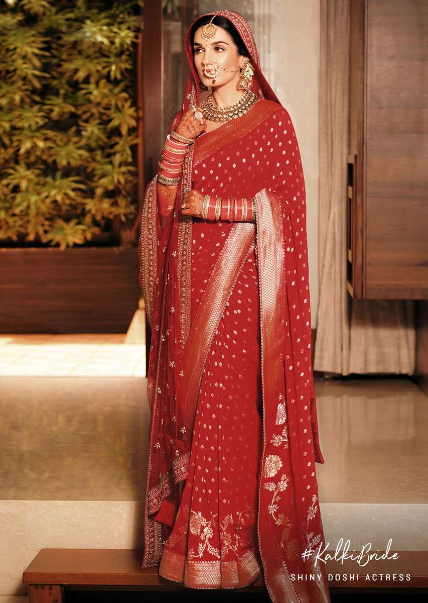 shiny_doshi_on_kalki_fiery_red_saree_in_georgette_with_brocade_buttis_and_floral_border.jpg