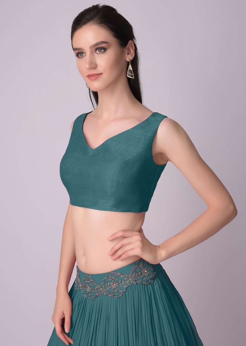 teal-blue-sleeveless-blouse-with-double-tie-up-tassel-dori-at-the-back-online-kalki-fashion-m001509617y-sg31211_5_4821b9e5-7c8e-4772-a8ff-326a88277c2f.jpg