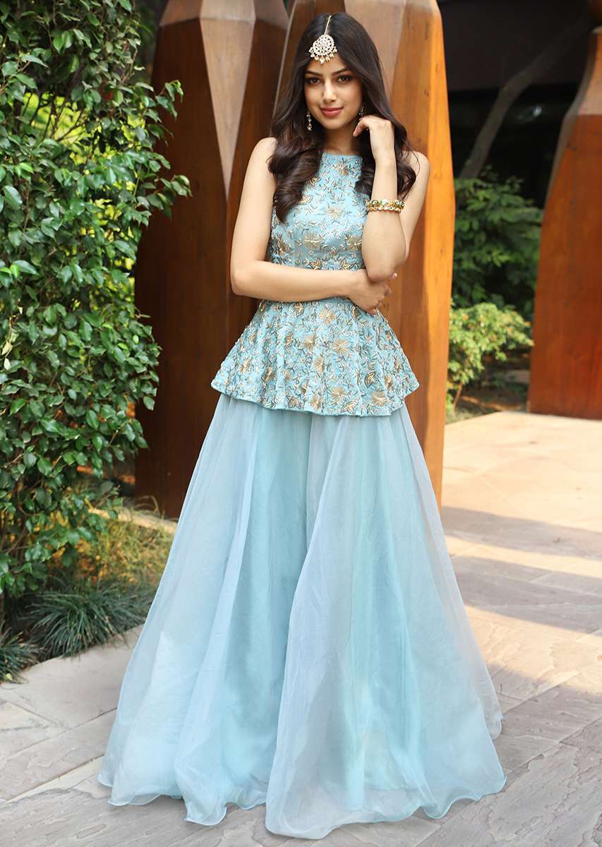 turq-blue-halter-neck-peplum-top-with-matching-organza-skirt-only-on-kalki_9dd23992-6ece-4dd3-bb62-5643311f678e.jpg