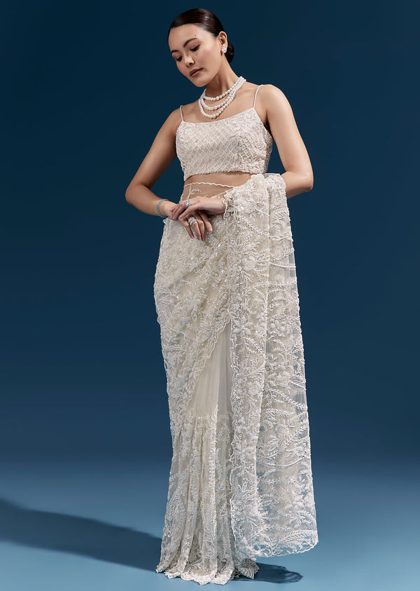 White Heavy Embroidered Net Saree With All Over Floral Jaal And Cutwork Border