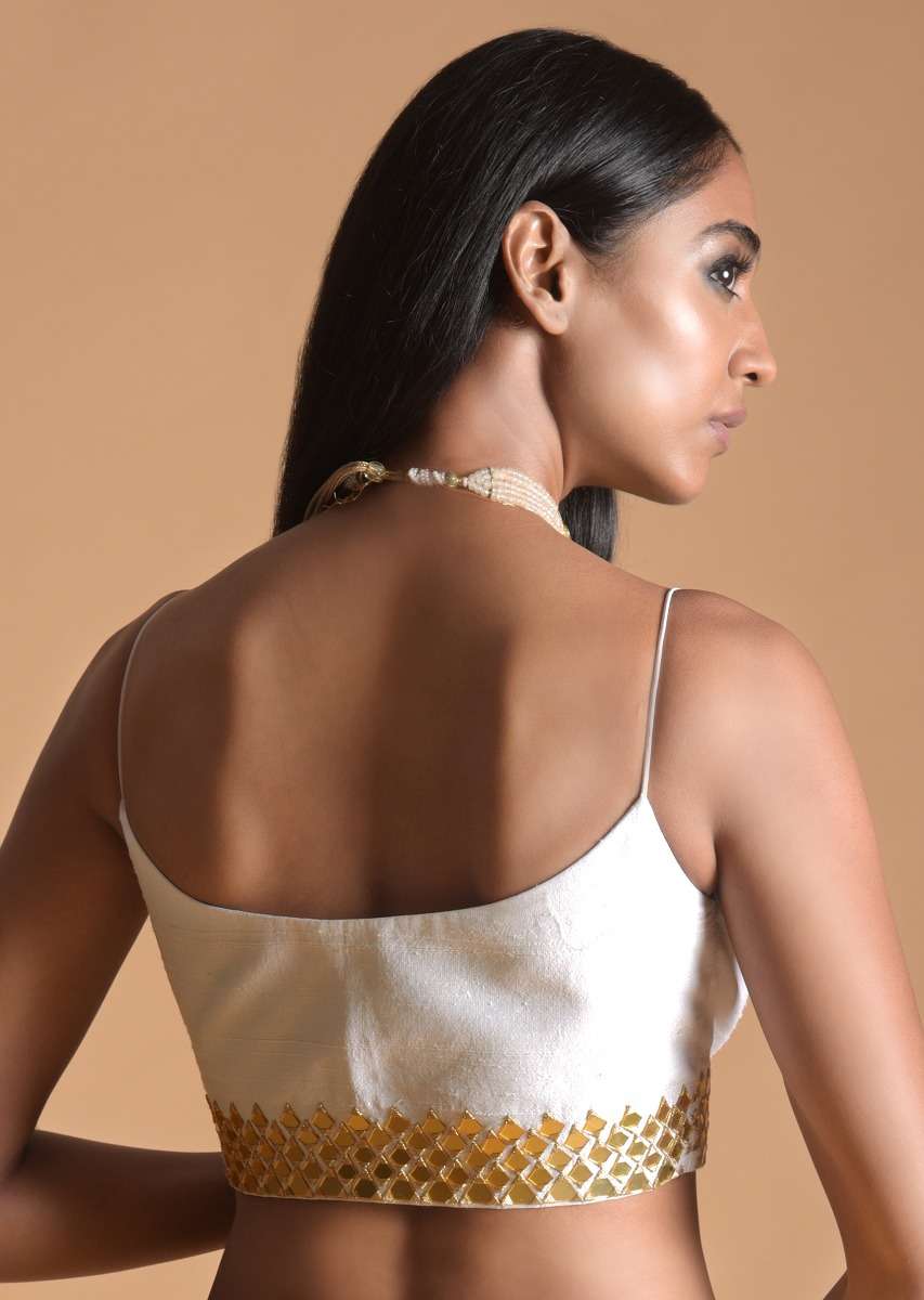 white_blouse_in_raw_silk_with_mirror_work_and_spaghetti_straps_on_the_shoulders_online_-_kalki_fashion_1__1_fe82eda9-9b9b-436b-9761-289f2b4703bf.jpg