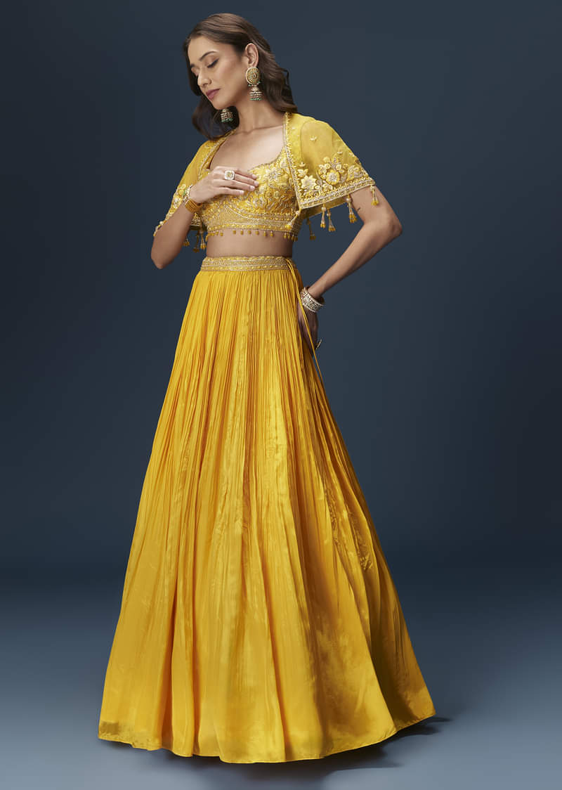 yellow-bridesmaid-lehenga-with-sleeveless-blouse-and-draped-cape-sg334681-1_2bcfb1f5-70c9-4939-91b2-9785346e3d9c.jpg