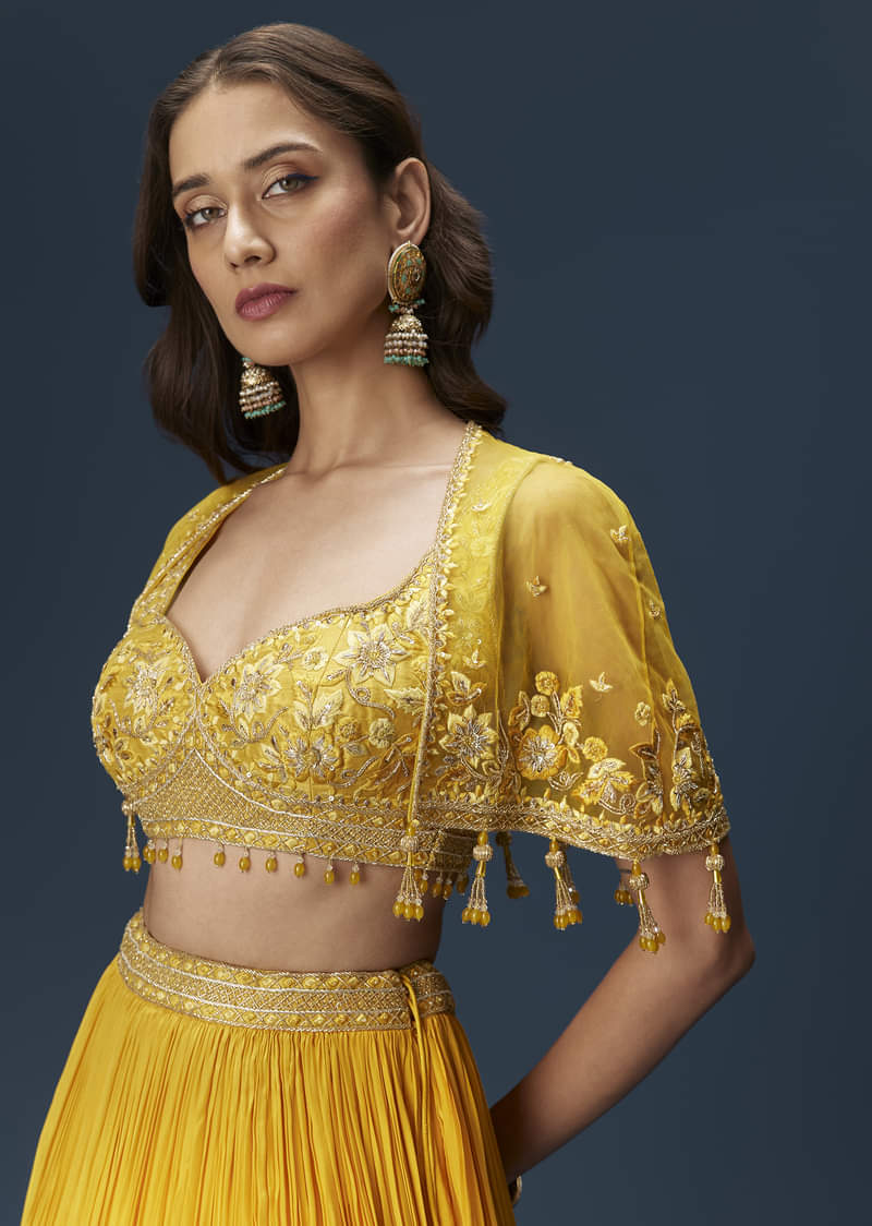 yellow-bridesmaid-lehenga-with-sleeveless-blouse-and-draped-cape-sg334681-3_3e3b4c0d-8f1c-4ea2-9a91-c9c6f2faae3b.jpg
